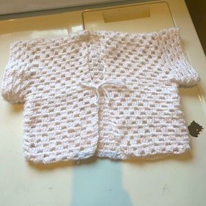 Soft, white hand made crochet cardigan cover up top.